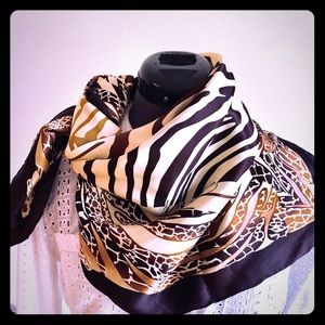 Scarf by Marciano. 100% silk.